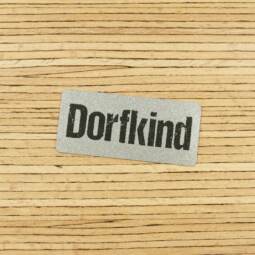 Ein Label zum Aufnähen - "Dorfkind" reflektierend (3M™ Scotchlite™)