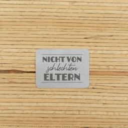 Ein Label zum Aufnähen - "NICHT VON schlechten ELTERN" reflektierend (3M™ Scotchlite™)